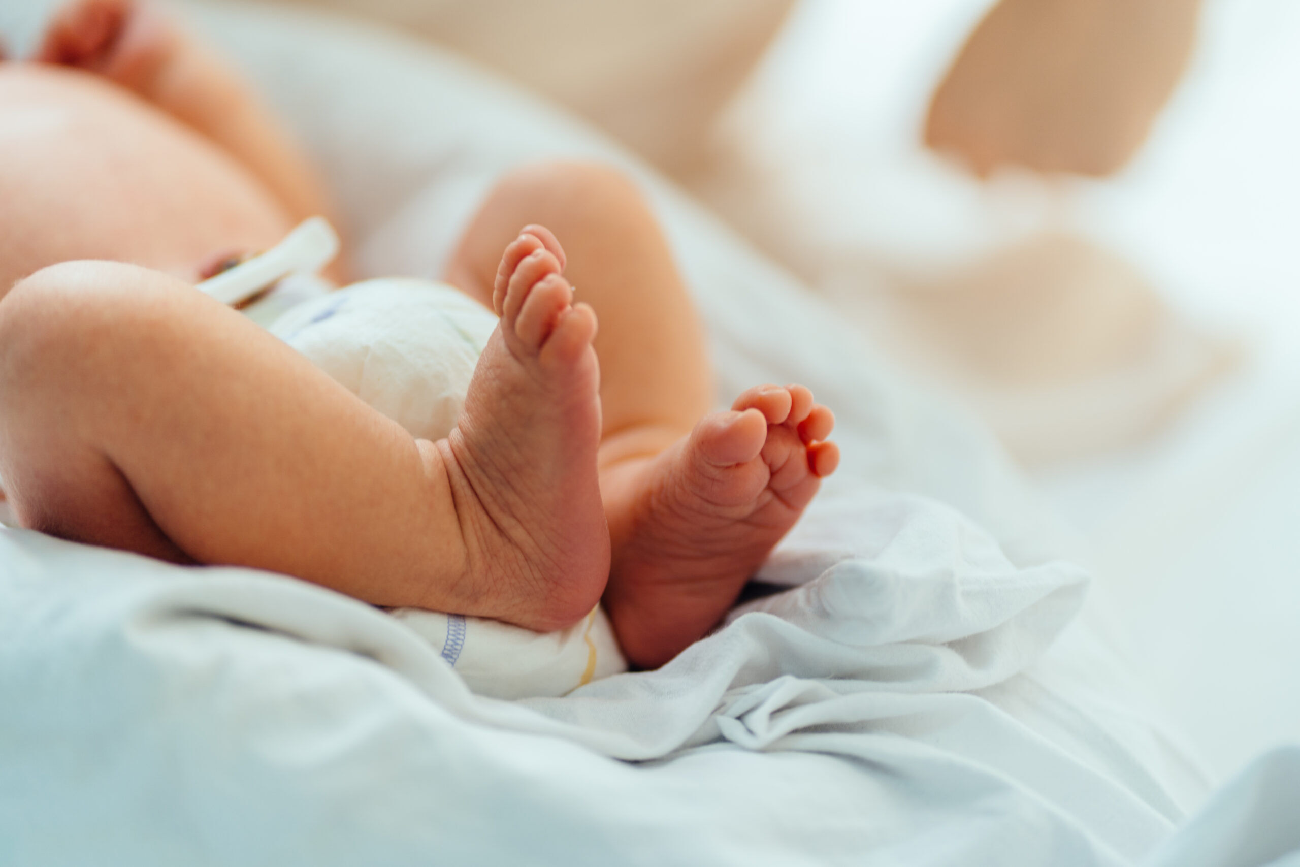 Trans throuple celebrates birth of new baby & shares their joy with the world