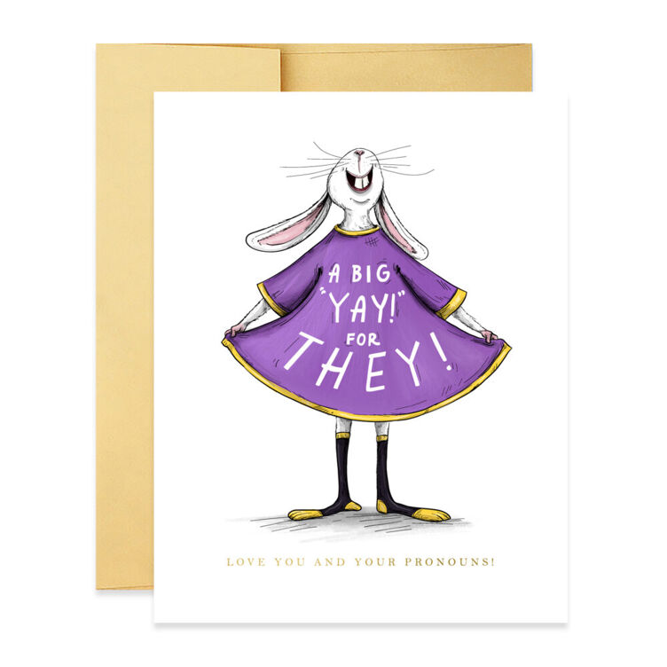A greeting card that show a joyful rabbit in a dress. The animals skirt is spread wide and reads, "A big yay for they!"