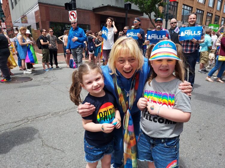 Mainer Deb Dagnon snaps a pic of Gov. Janet Mills with Dagnon's granddaughters Lydia and Eleanor at the Portland Pride parade