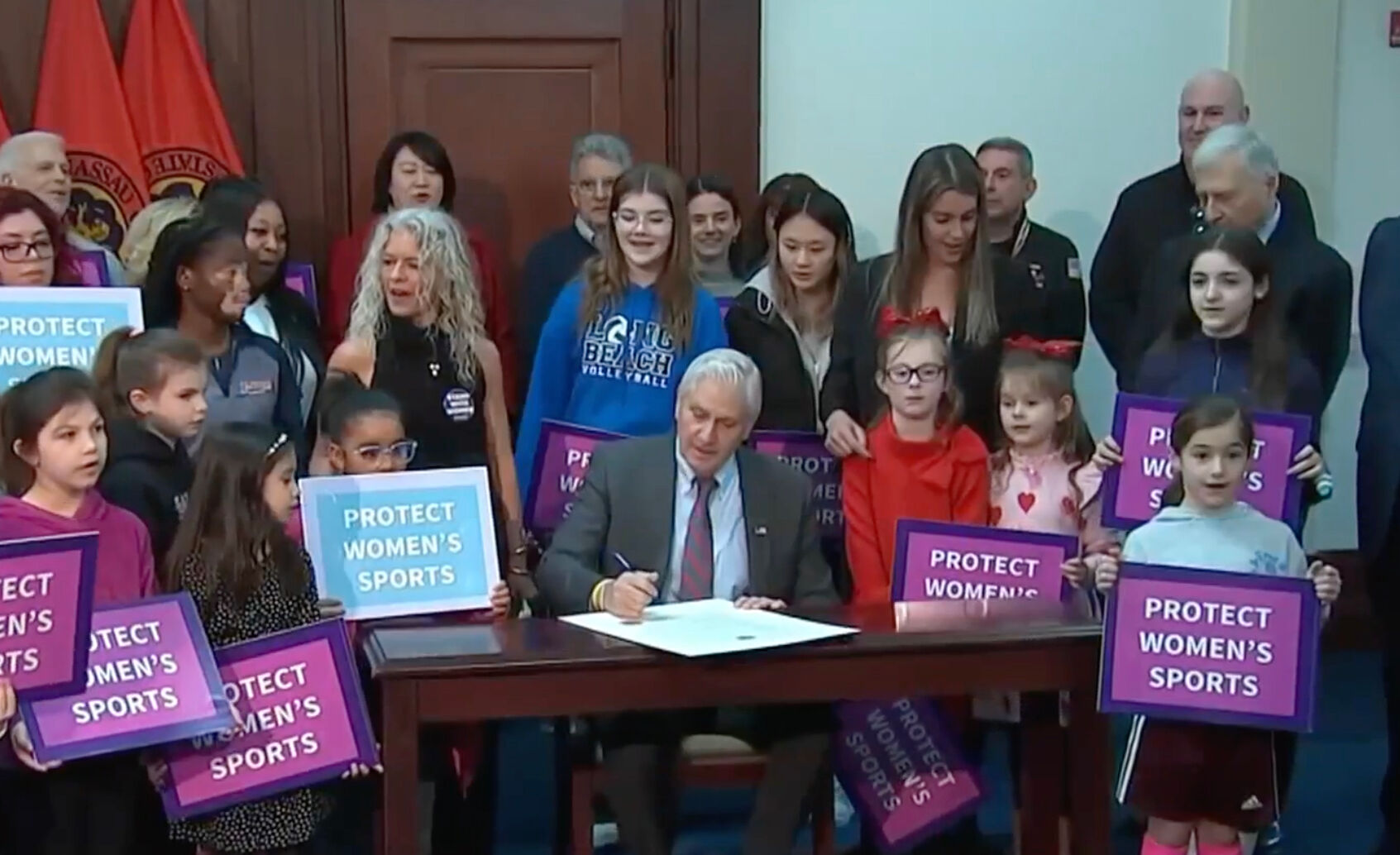 Nassau County Executive Bruce Blakeman signing the anti-trans sports ban in February.