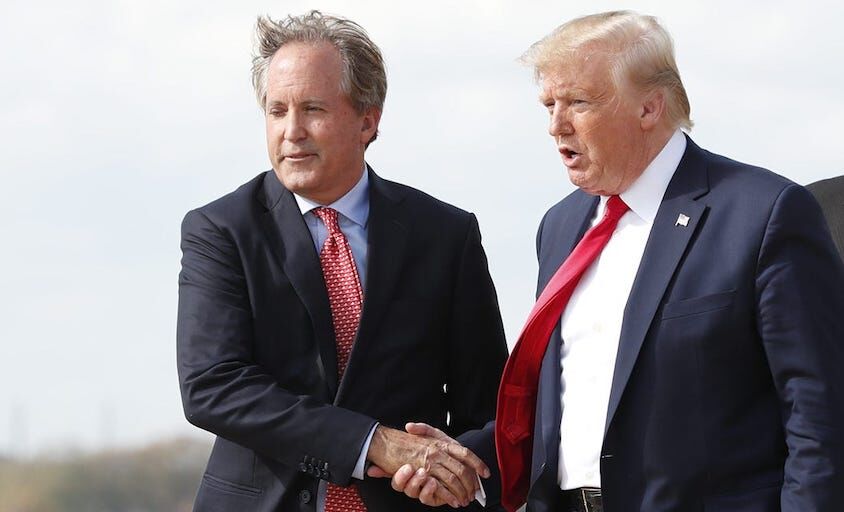 donald-trump-ken-paxton-attorney-general Donald Trump greets Texas Attorney General Ken Paxton as Lt. Governor Dan Patrick follows at Austin Bergstrom International Airport on Nov. 20, 2019