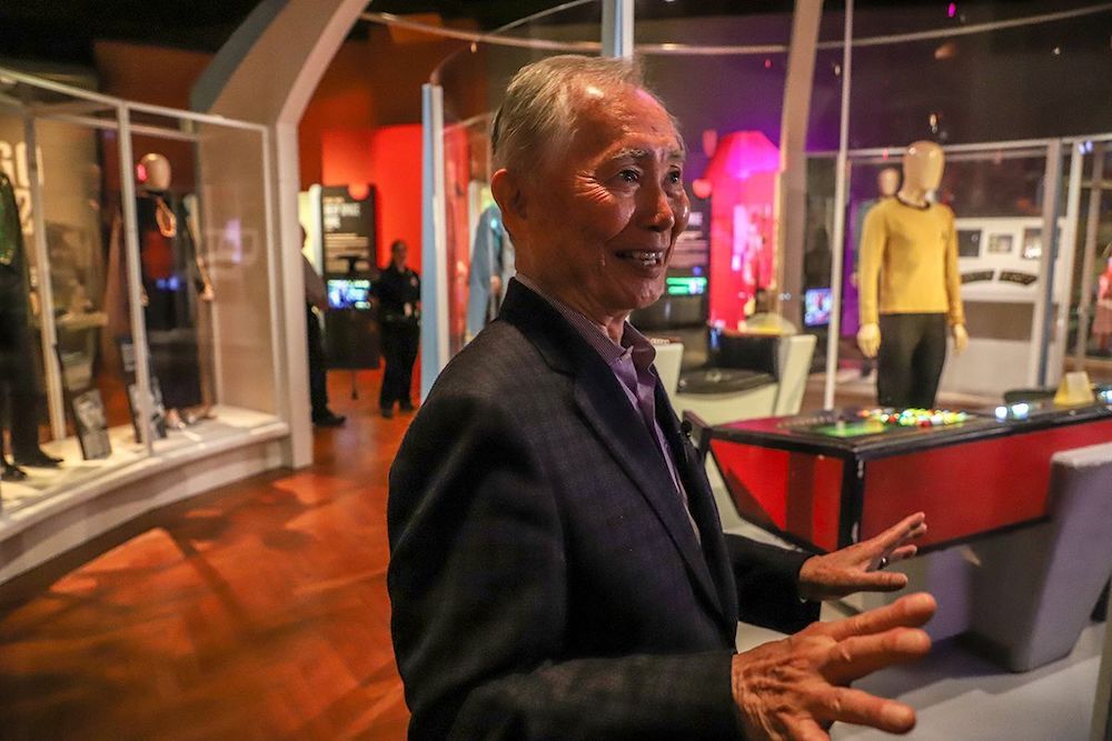 Actor George Takei stands in front of the original set where he played Hikaru Sulu, the helmsman of the USS Enterprise in the television series Star Trek, as he tours the Start Trek: Exploring New Worlds exhibit at the Henry Ford museum in Dearborn, Mich. on Friday, May 17, 2019. 

Takei 051719 Kpm 197