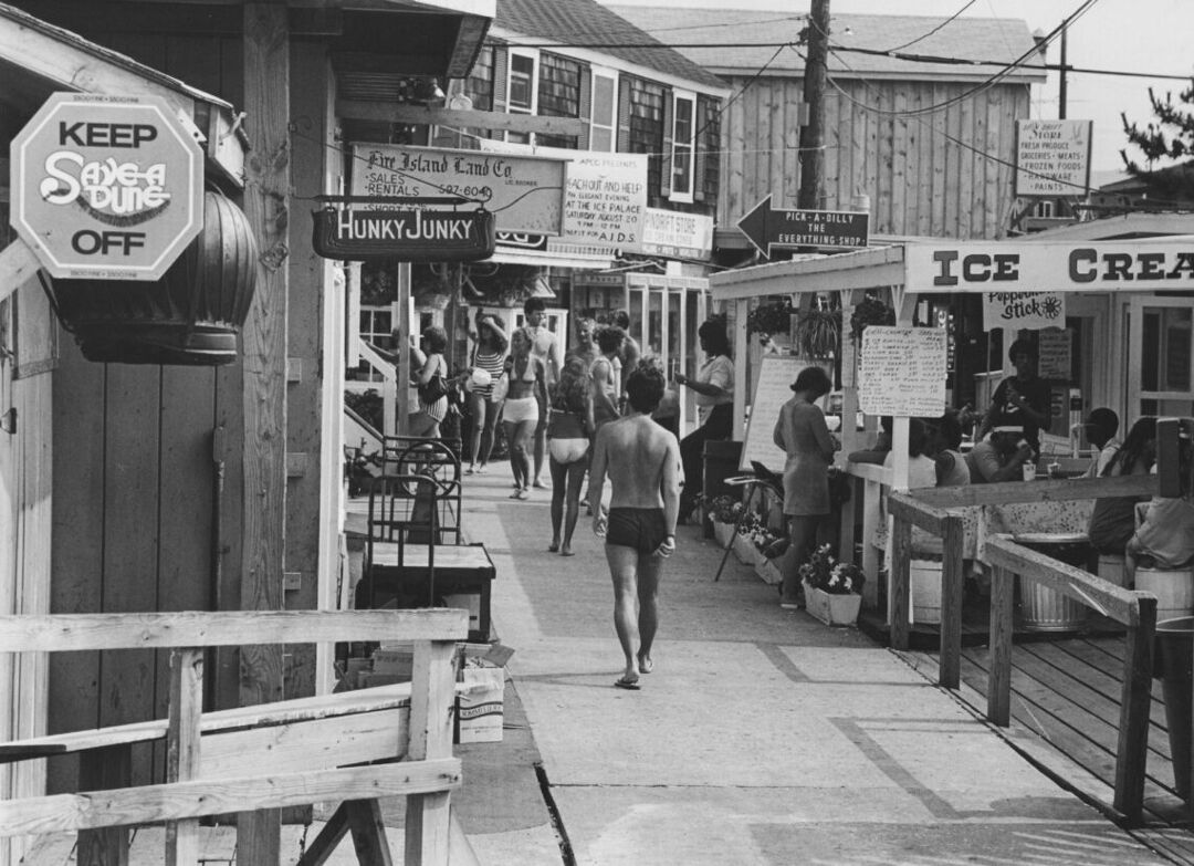 Vacationers walk down the boardwalk in Cherry Grove in the early 1980s.