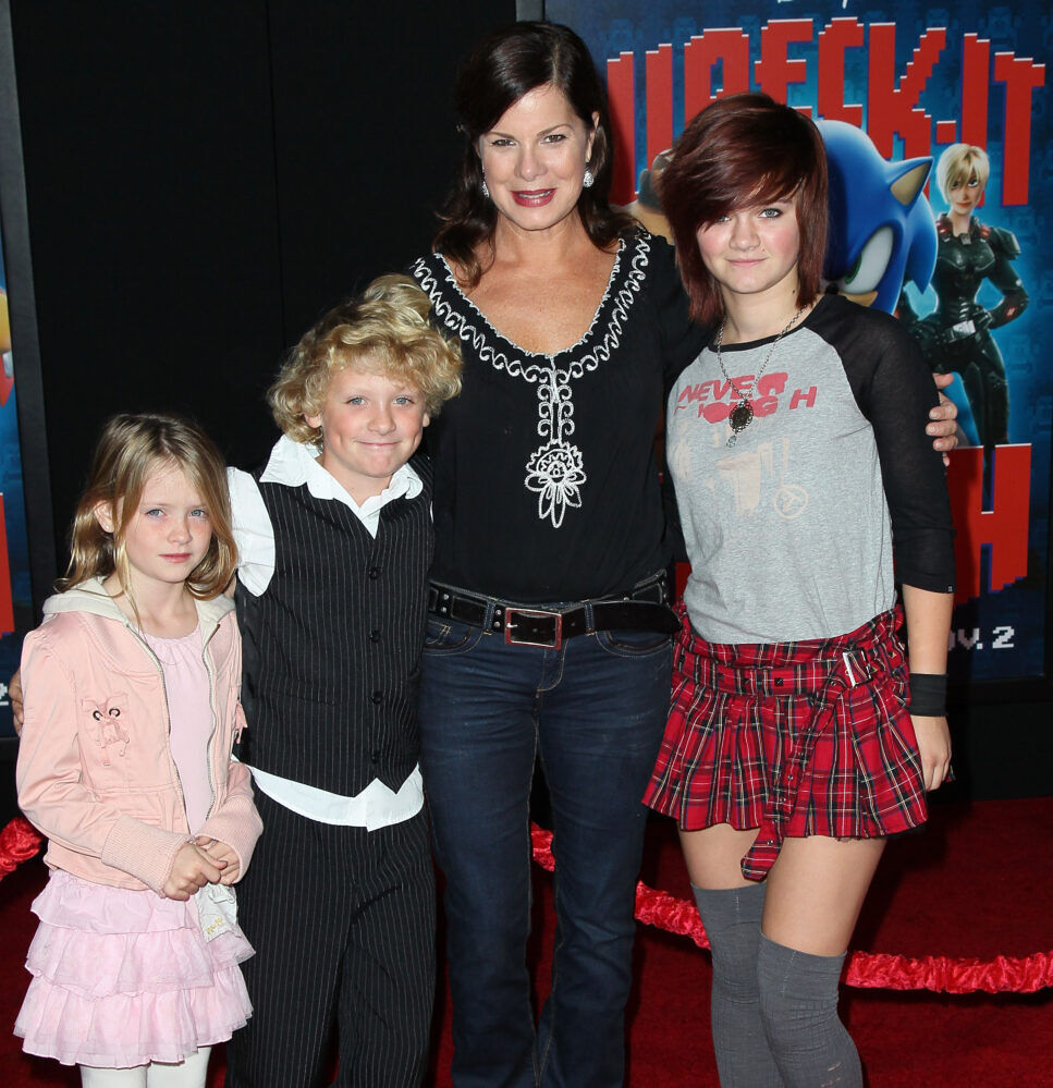 Marcia Gay Harden with her children at a movie premiere.