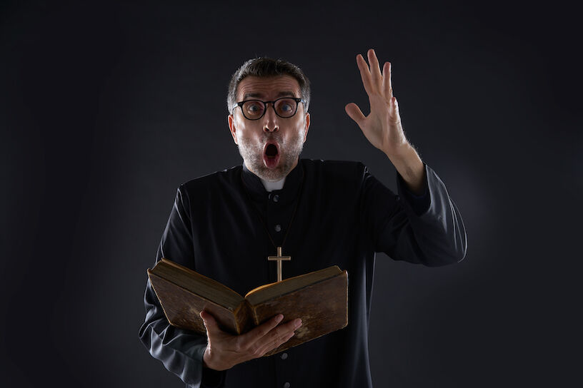 Mad crazy priest surprised expression scared