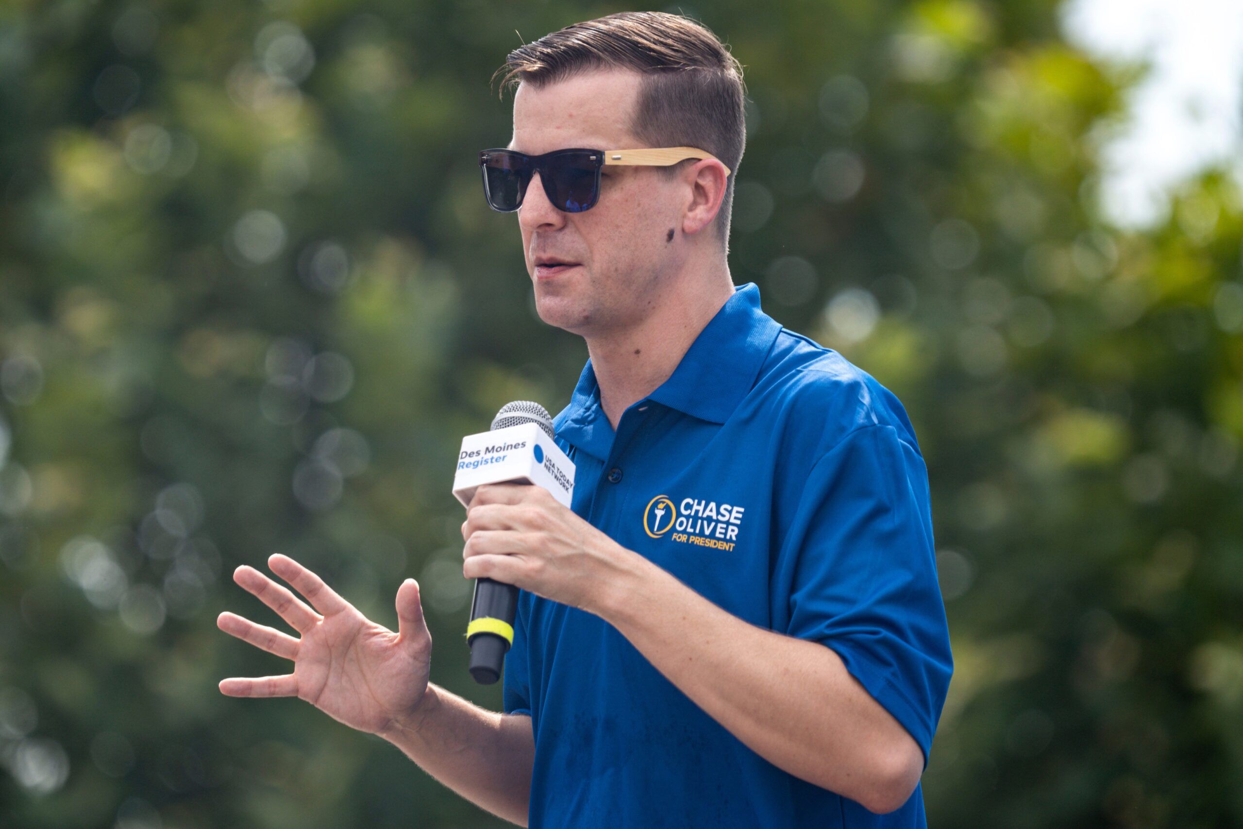 Libertarian presidential candidate Chase Oliver speaks at the Des Moines Register Political Soapbox during day 10 of the Iowa State on Saturday, August 19, 2023 in Des Moines.