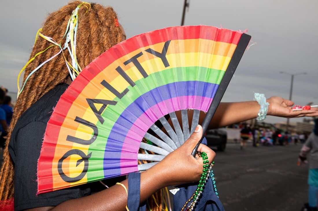 Kat Bailey hands out candy during the Pride Parade on Saturday, Oct. 7, 2023, in Corpus Christi, Texas.
