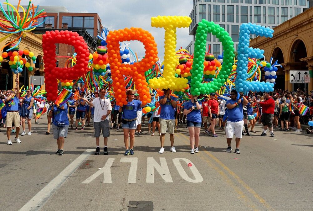 Members of the OhioHealth group carry balloons during the 2017 Stonewall Columbus Pride Parade in Columbus, Ohio on June 17, 2017.