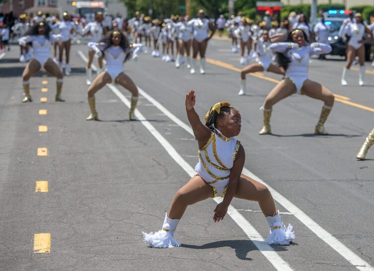 Dancers from Studio 309 perform while walking in the inaugural Ernestine Jackson Juneteenth Freedom Day Parade on Saturday, June 15, 2024 in South Peoria.