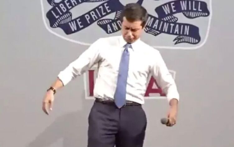 Pete Buttigieg noticing a bee has landed on him