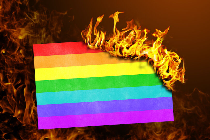Flag burning - concept of war or crisis - Rainbow flag
