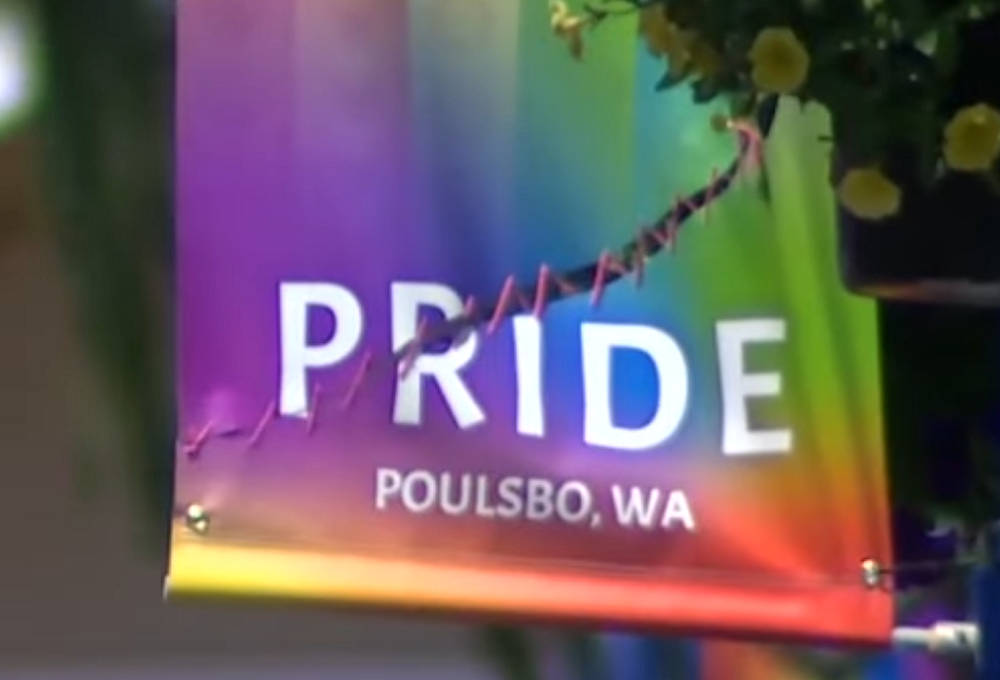 A Poulsbo Pride banner stitched back together