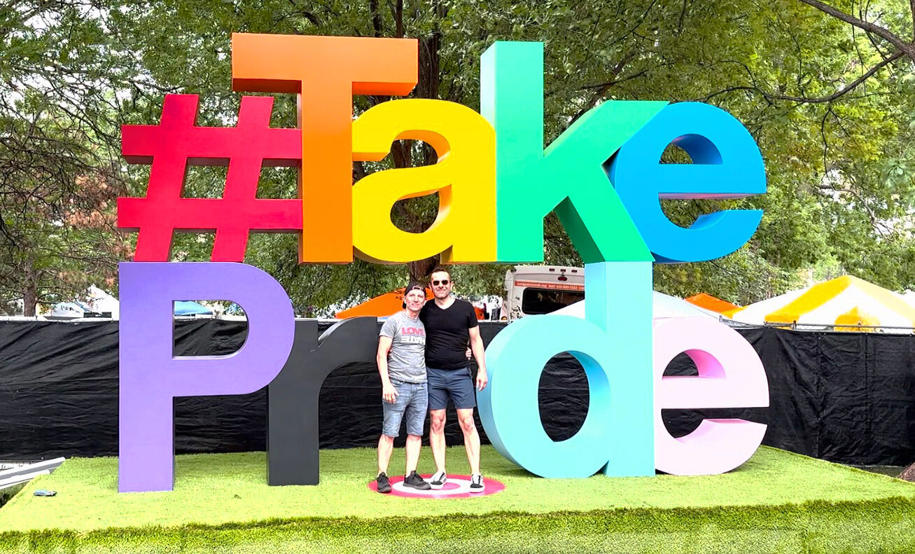 James Roy, left, with his boyfriend at Twin Cities Pride in 2023