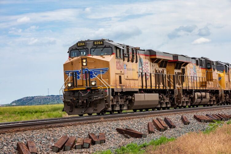 A Union Pacific diesel locomotive carries cargo from the station in Cheyenne towards Pine Bluffs and the Plains of the Midwest.