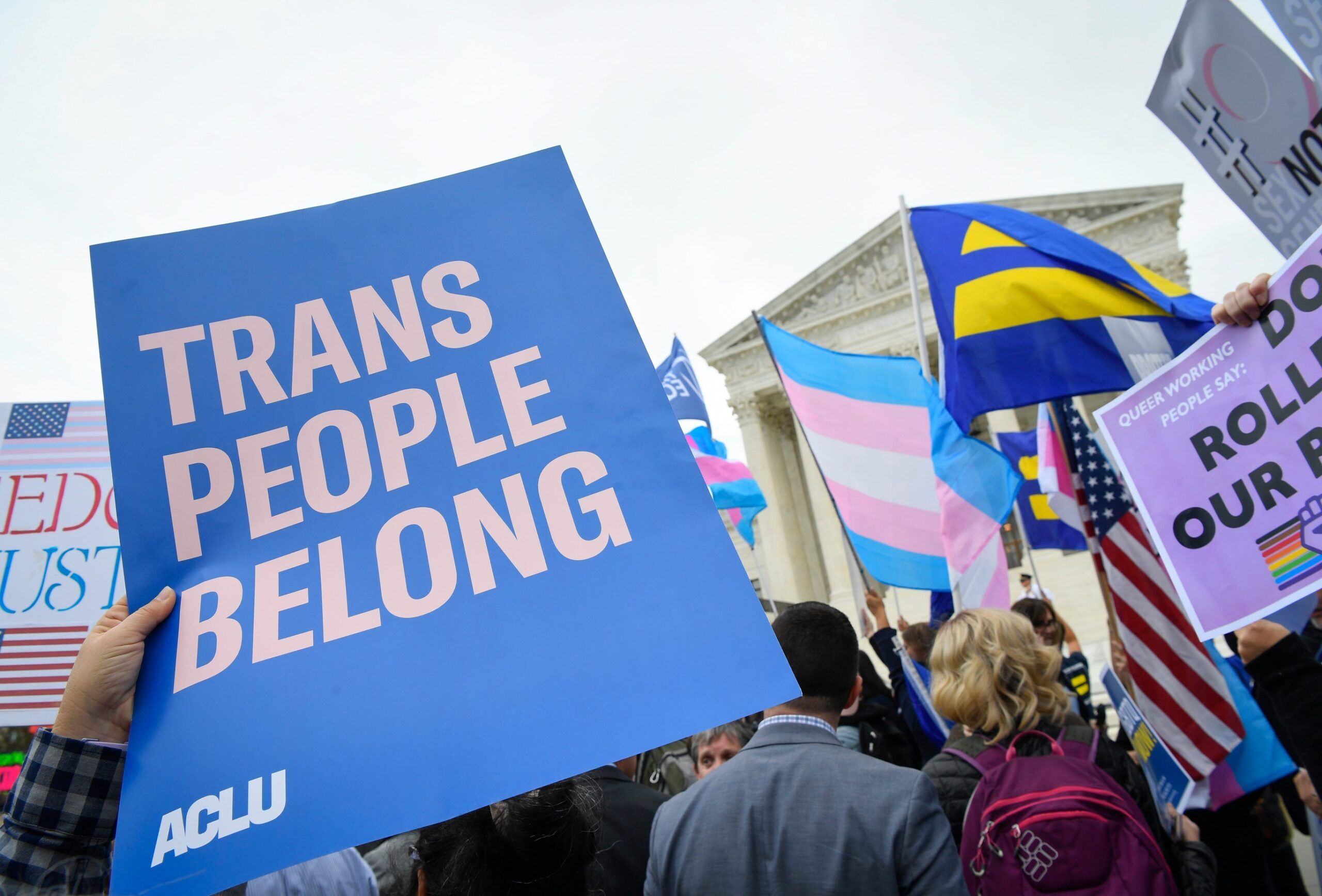 Protestors and supporters gather in front of the U.S. Supreme Court on Oct. 8, 2019 in Washington as the justices hear three challenges from New York, Michigan and Georgia involving workers who claim they were fired because they were gay or transgender.