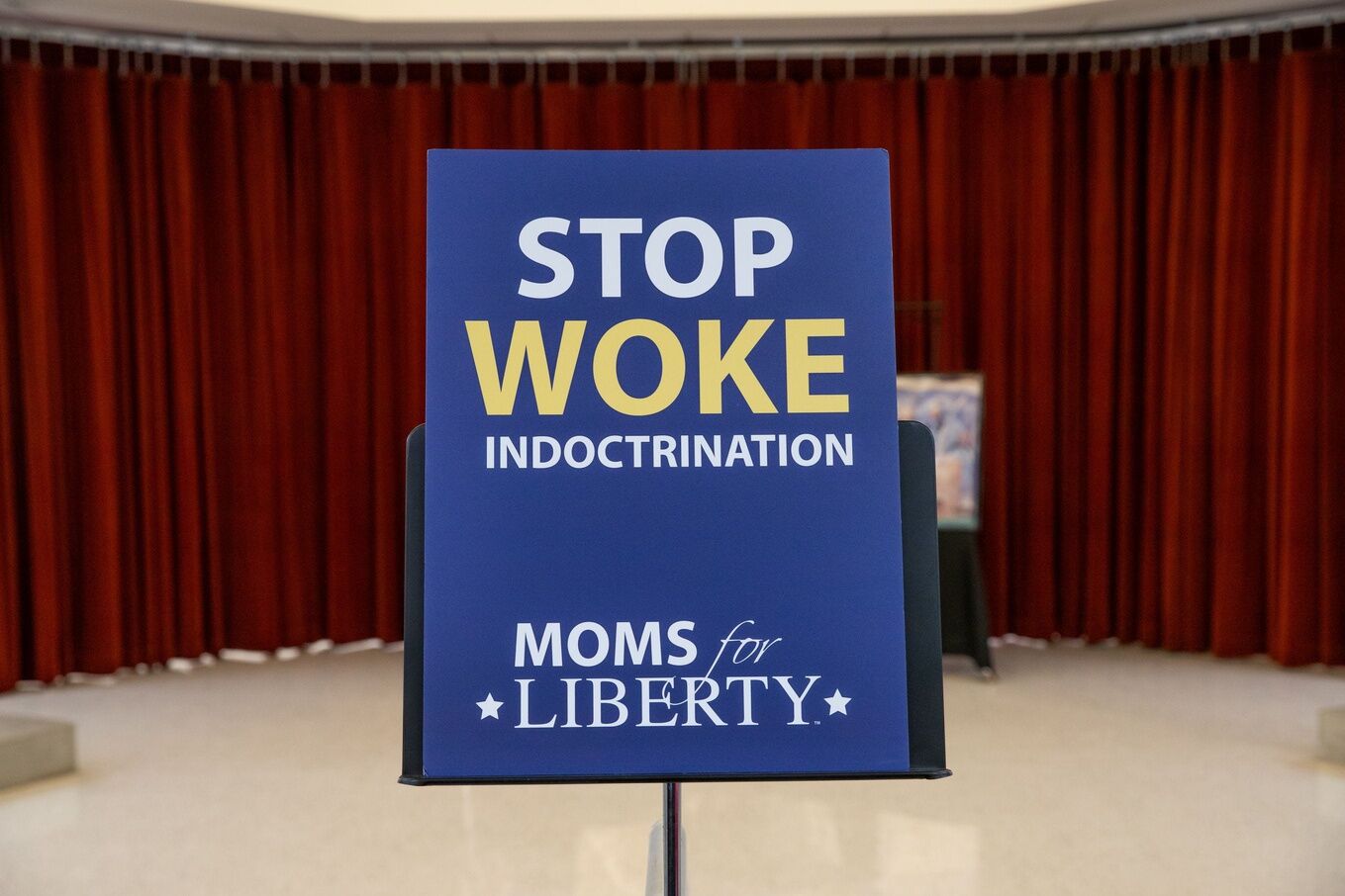 A sign at a town hall organized by Moms for Liberty at Pathfinder Academy in Mesa on Sept. 14, 2023.