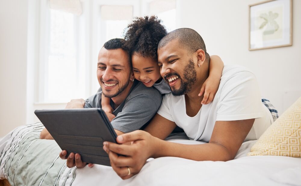 Gay dads and their kids in a stock image