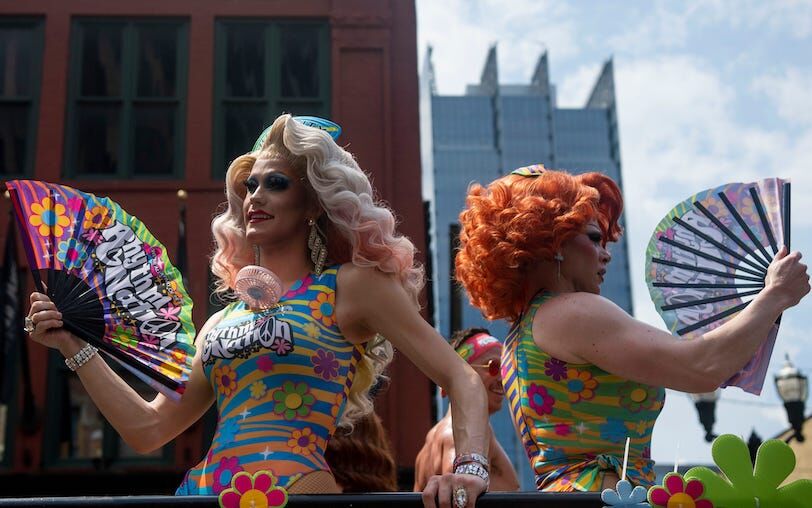 Drag Queens with the Rhythm Nation float ride in the 2024 Pride parade downtown in Nashville, Tennessee.