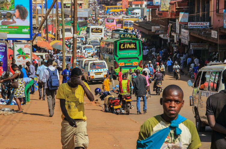 Kampala, Uganda - January 28, 2018: The street life of Uganda's capital. Crowd of people on the streets and heavy traffic