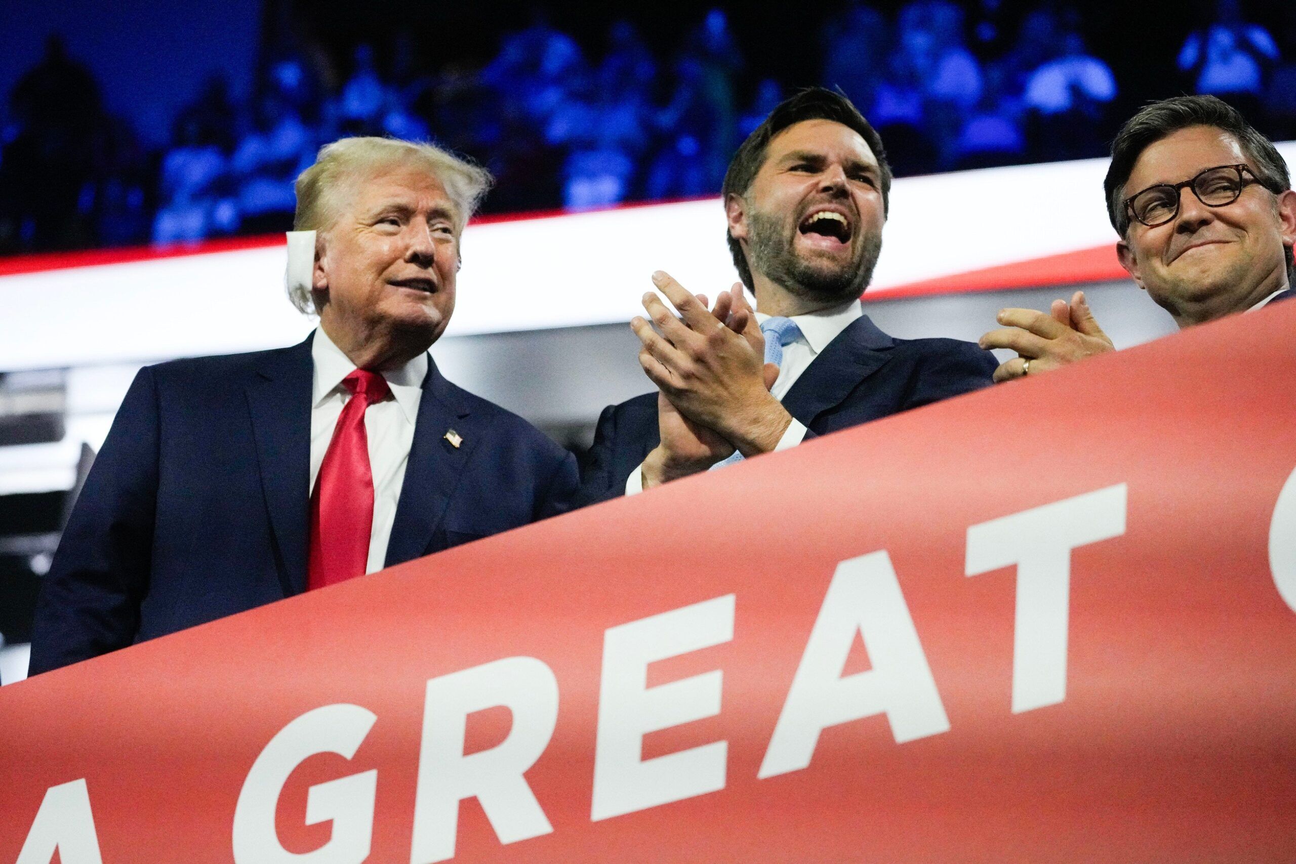 Former President Donald Trump appears with Republican vice president nominee JD Vance and Speaker of the House Mike Johnson during the first day of the Republican National Convention