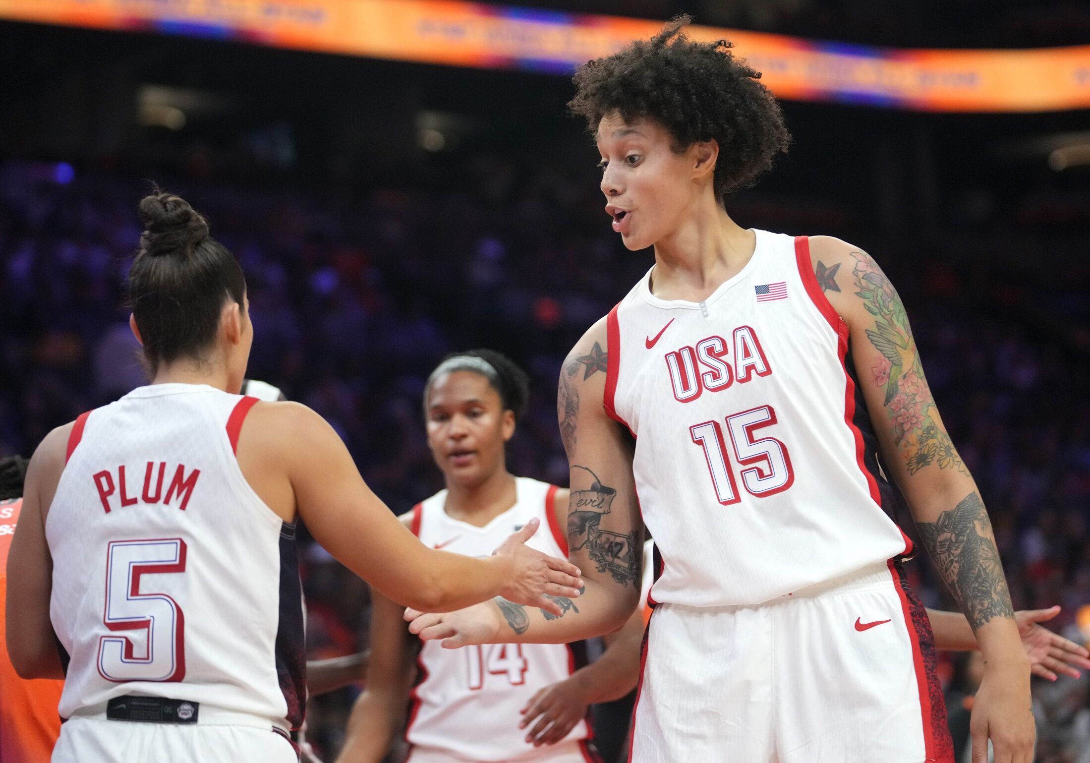 Team USA center Brittney Griner (15) high-fives teammate Kelsey Plum (5) during the WNBA All-Star Game against Team WNBA at Footprint Center in Phoenix on July 20, 2024.