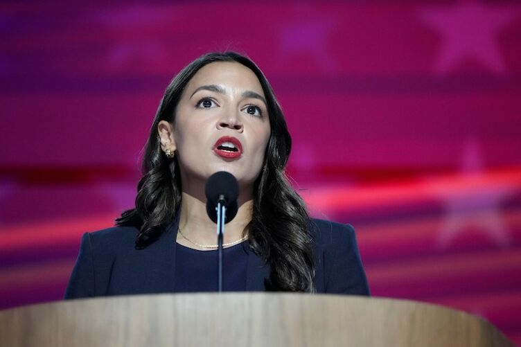 Aug 19, 2024; Chicago, IL, USA; Rep. Alexandria Ocasio-Cortez, D-N.Y. speaks during the first day of the Democratic National Convention at the United Center. The DNC program will feature President Joe Biden and Former Secretary of State Hillary Clinton during Monday's ceremonies. Mandatory Credit: Josh Morgan-USA TODAY