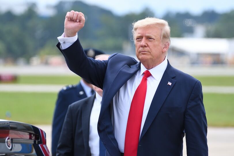 MARIETTA, GA- SEPTEMBER 25, 2020: President Donald Trump gives a fist pump arriving at Dobbins Air Reserve Base. He will be speaking on Black Economic Empowerment at the Cobb Galleria Center.