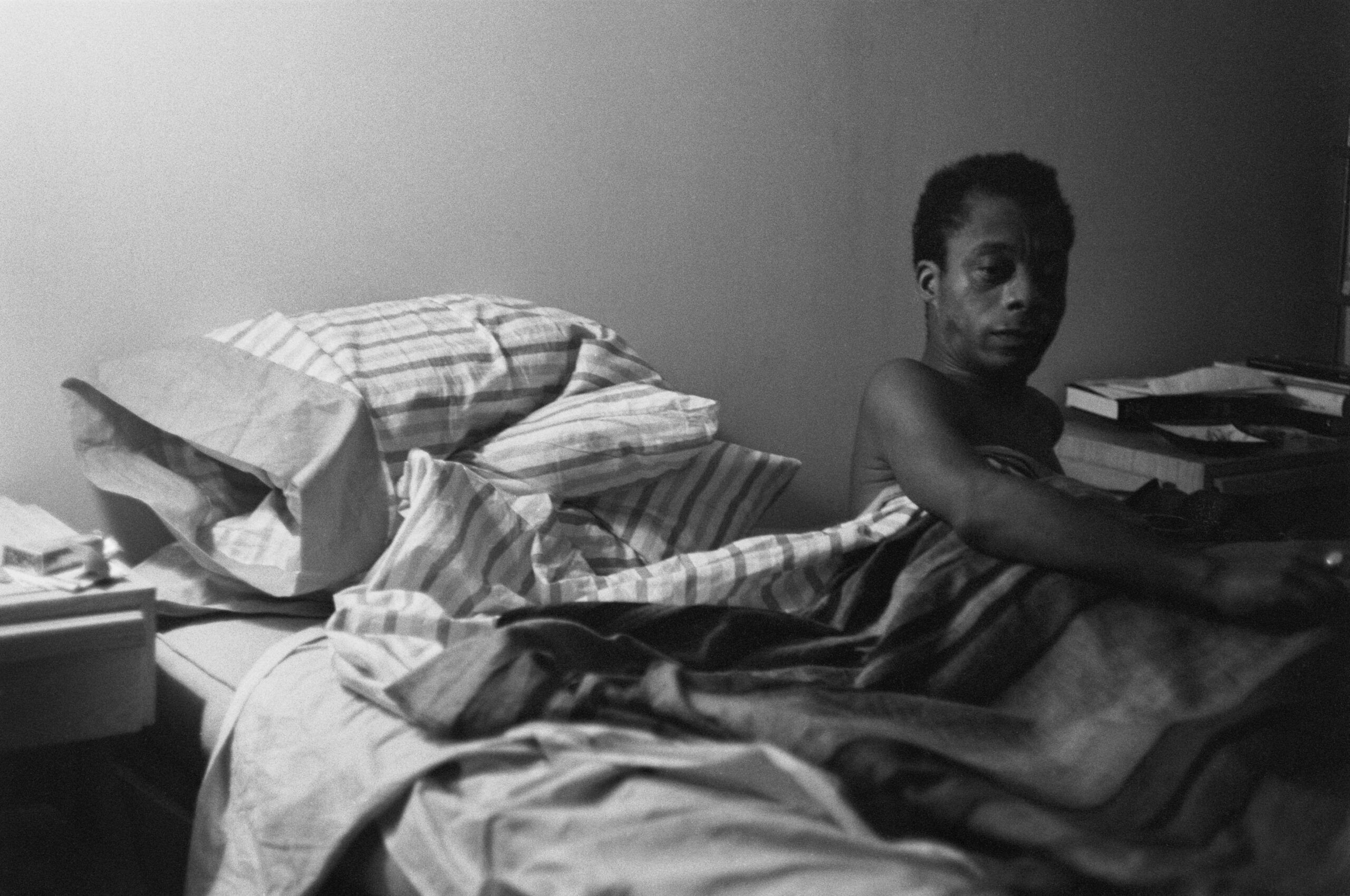 American novelist and activist James Baldwin in bed, 1963.