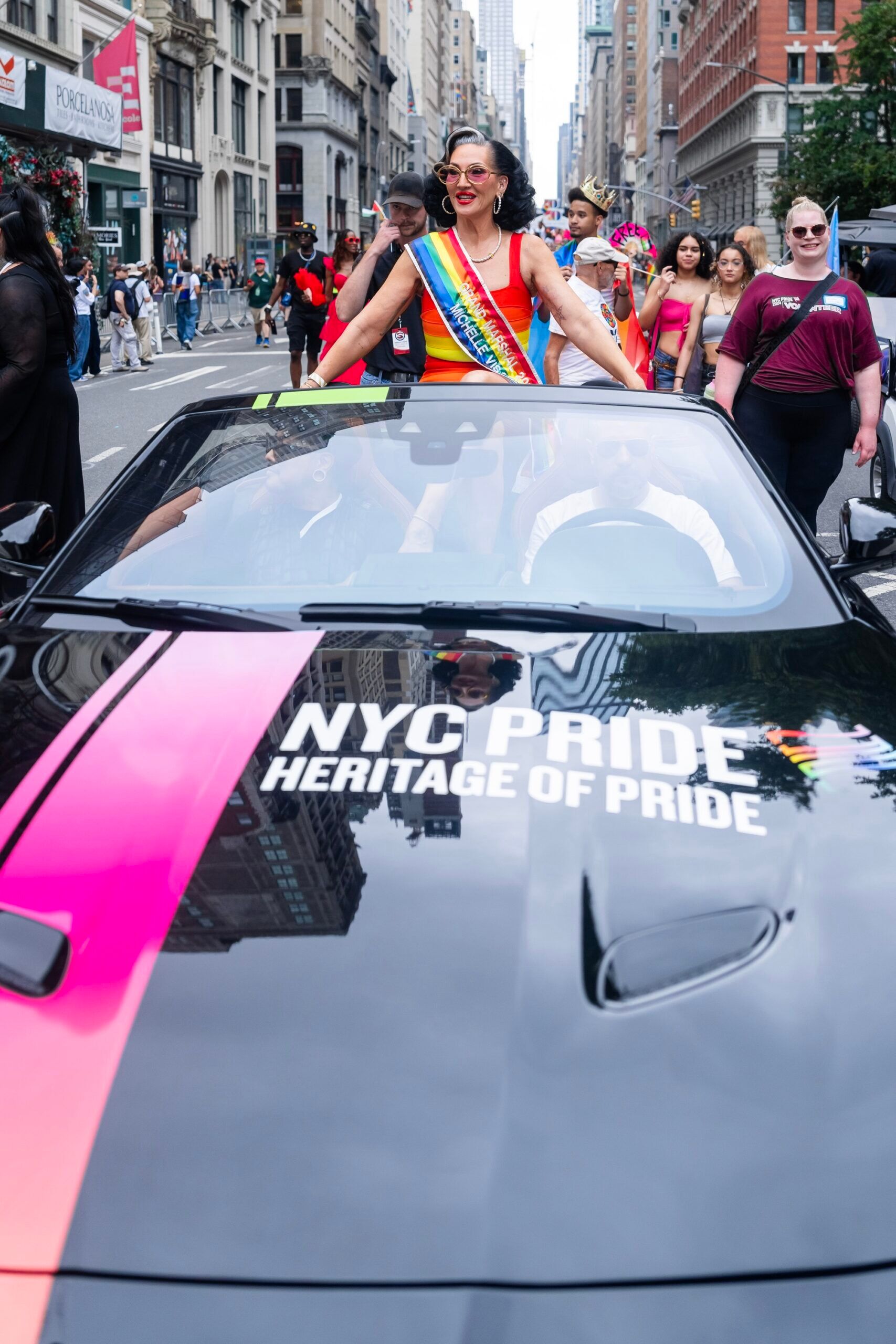 Michelle Visage ride in a Jaguar Land Rover convertible at NYC Pride.