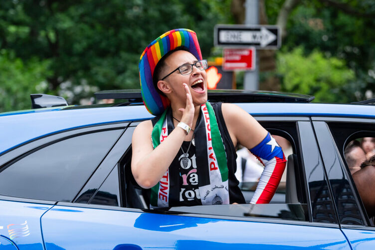 Grand marshal Robin Drake rides in a Jaguar F-PACE at the 2024 NYC Pride