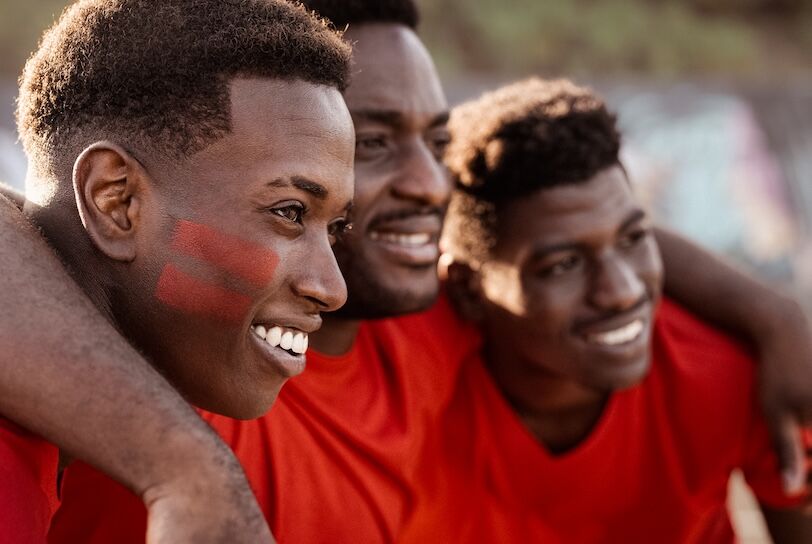 African football fans having fun supporting their favorite team - Sport entertainment concept