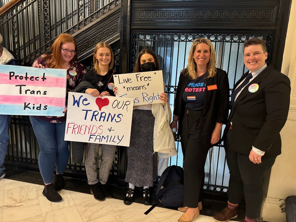 The author (far right) with trans rights advocates at the New Hampshire state House in spring of 2024.