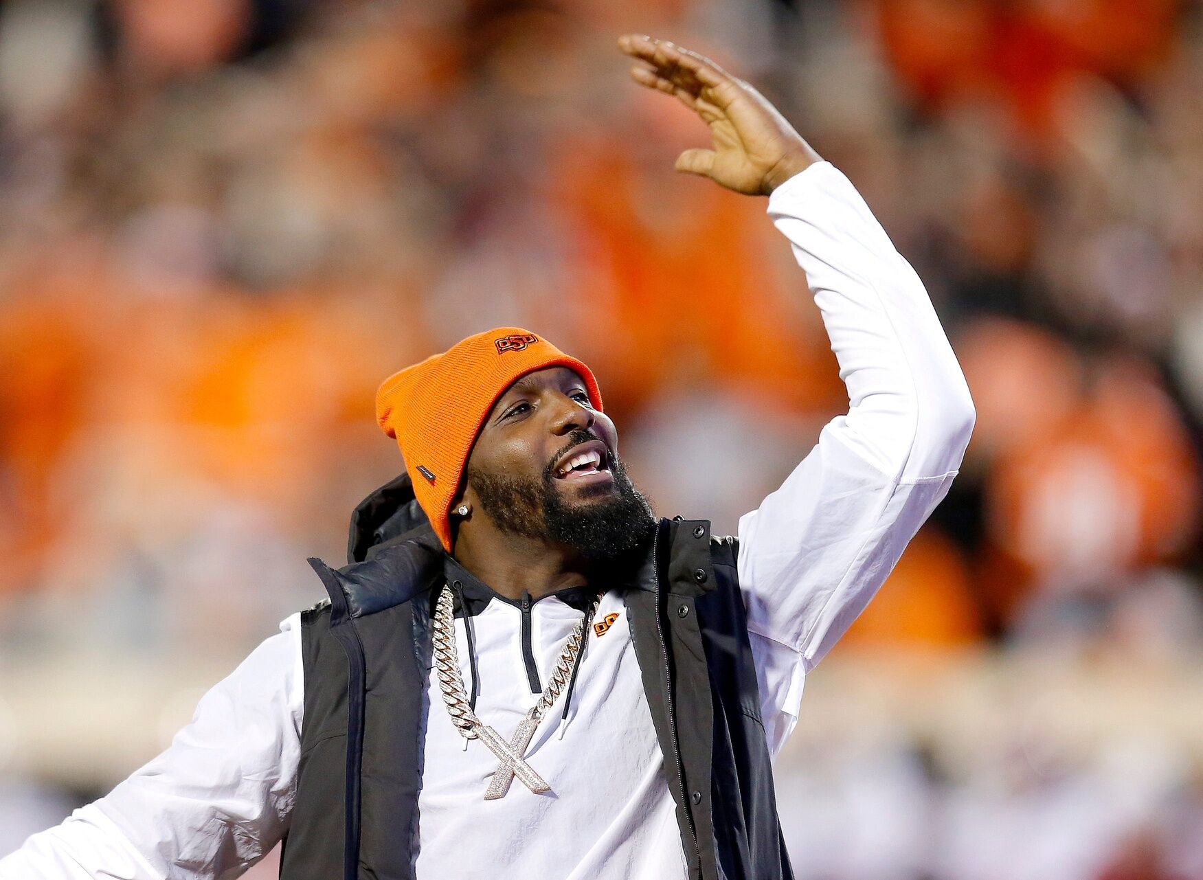 Dez Bryant pumps up the crowd during a Bedlam college football game on November 27, 2021