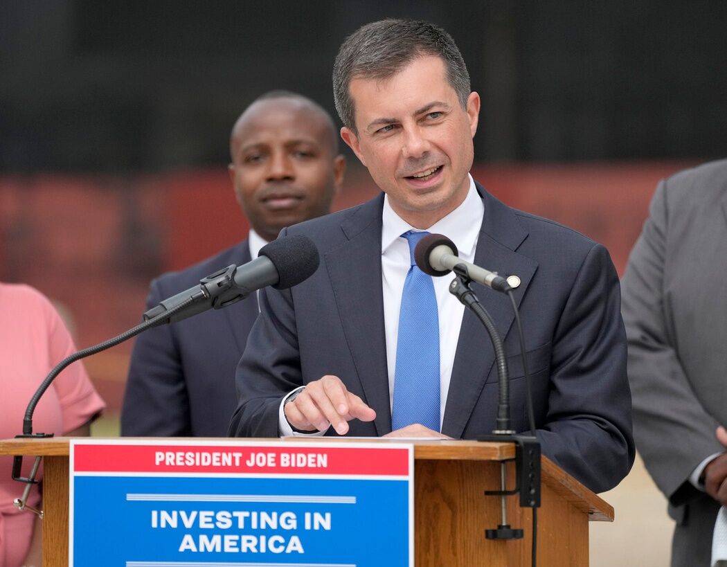 Secretary of Transportation Pete Buttigieg speaks as Milwaukee Mayor Cavalier Johnson looks on at DeLong Co. in the Port of Milwaukee as part of the Secretary’s Great Lakes Ports tour in Milwaukee on Wednesday, July 31, 2024.