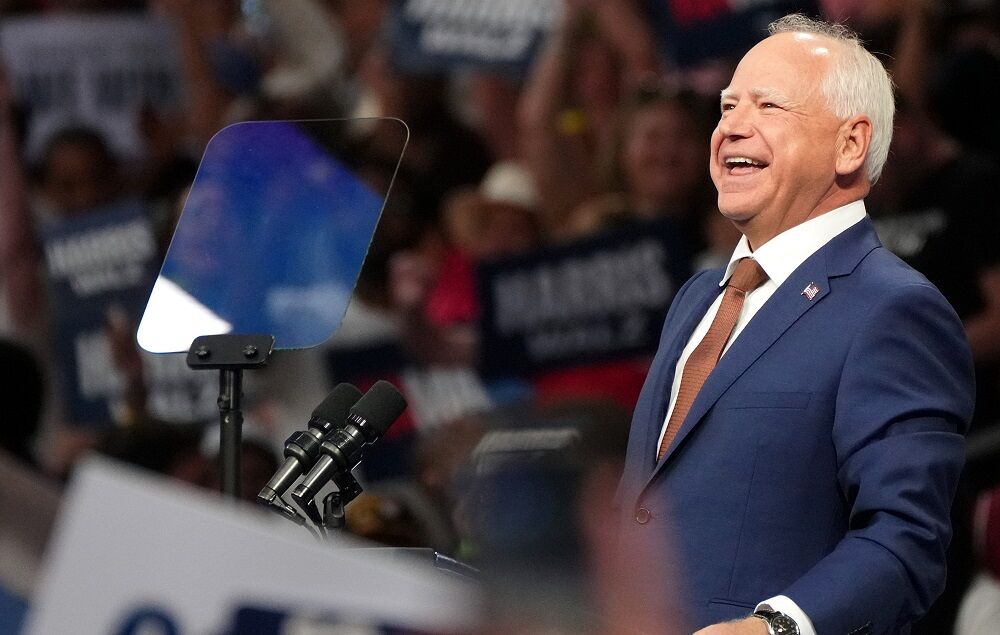 Minnesota Gov. Tim Walz speaks during a campaign rally with Vice President Kamala Harris at the Desert Diamond Arena in Glendale on Aug. 9, 2024.