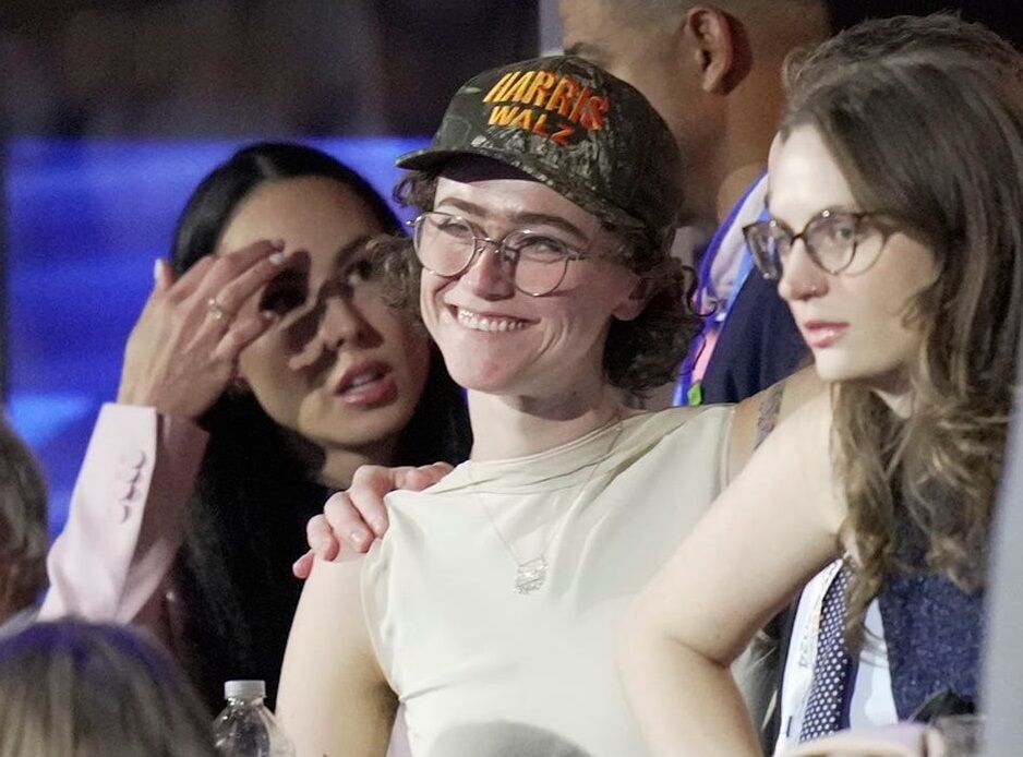 Aug 19, 2024; Chicago, IL, USA; Ella Emhoff is seen wearing a Harris-Walz camo hat during the first day of the Democratic National Convention at the United Center. The DNC program will feature President Joe Biden and Former Secretary of State Hillary Clinton during Monday's ceremonies.