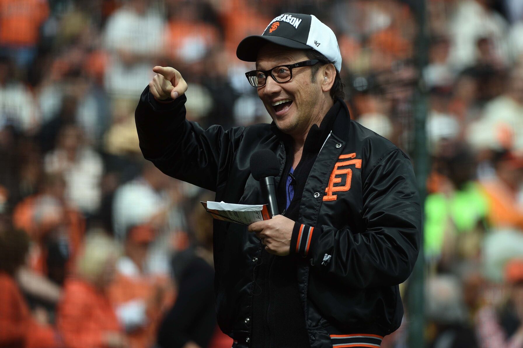 Oct 14, 2014; San Francisco: Film and television actor Rob Schneider cheers before game three of the 2014 NLCS playoff