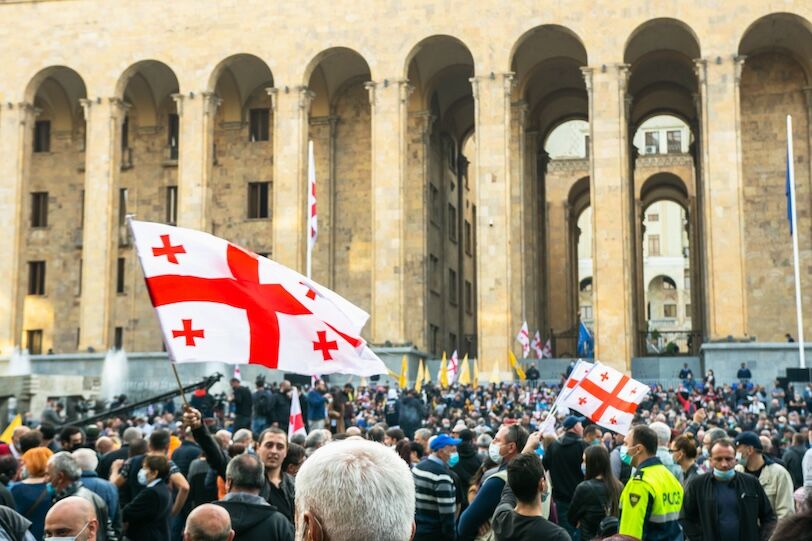 Crowds of people standing in front of Georgia's Parliament building on November 1, 2020.