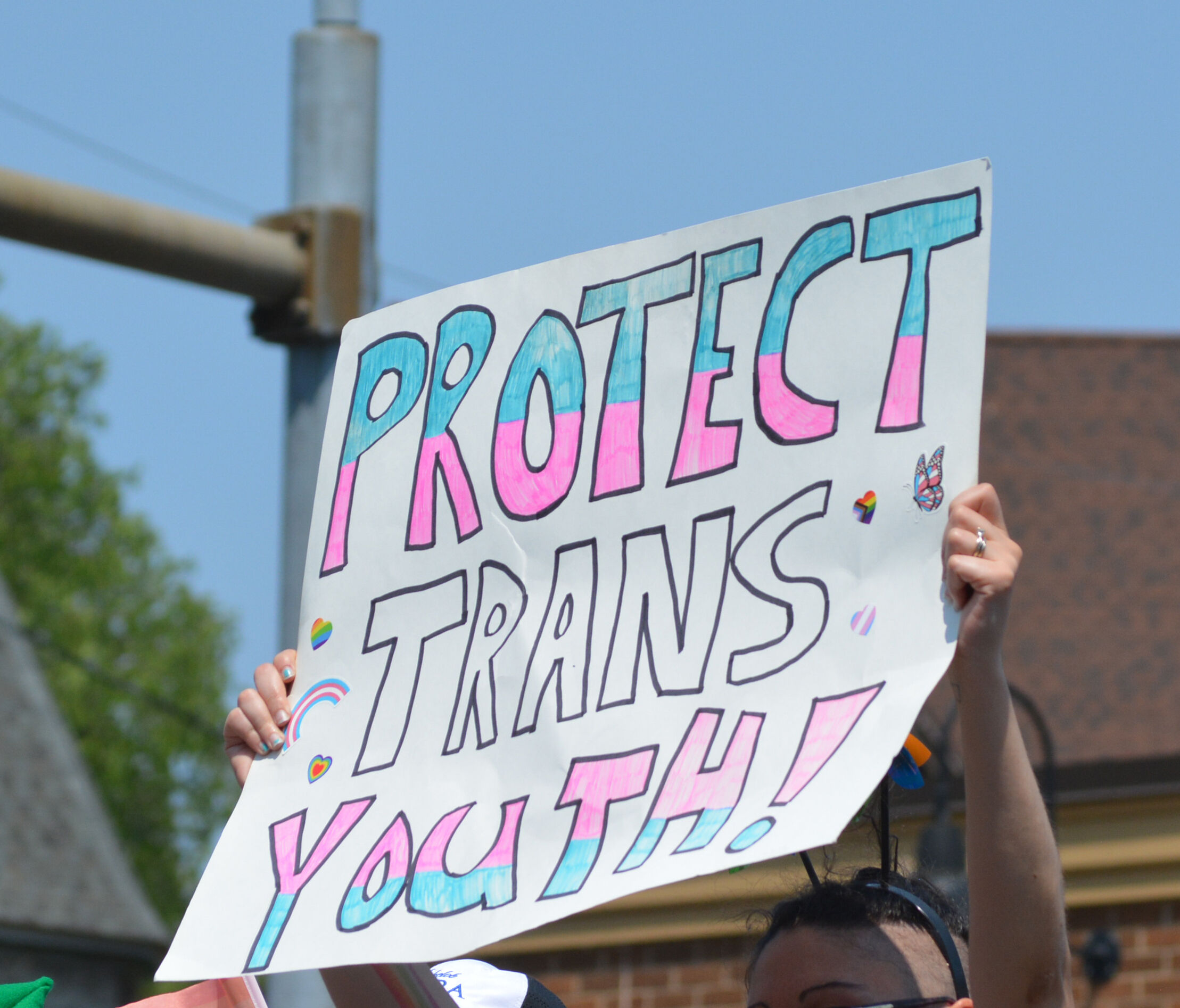 "Protect trans youth" sign