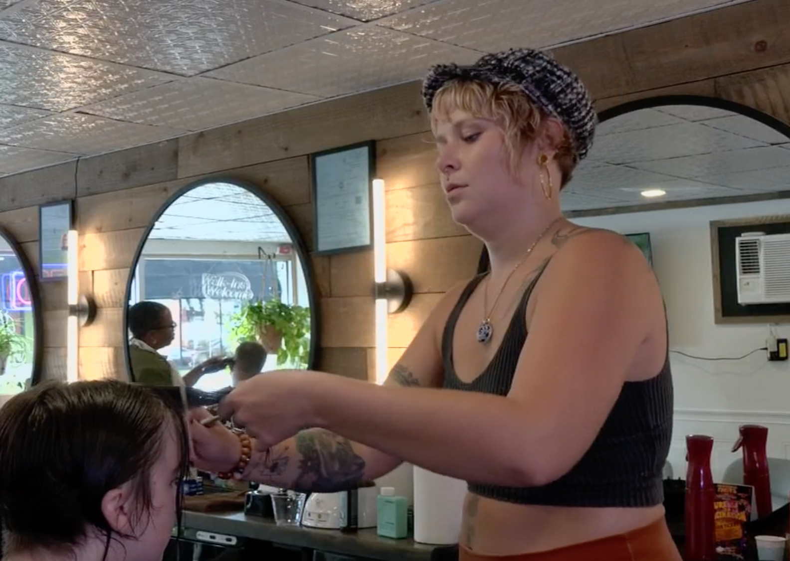 A hairdresser giving a haircut in Louisville