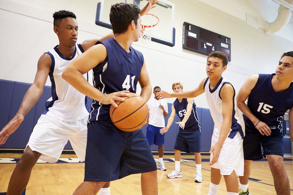 Boys playing basketball