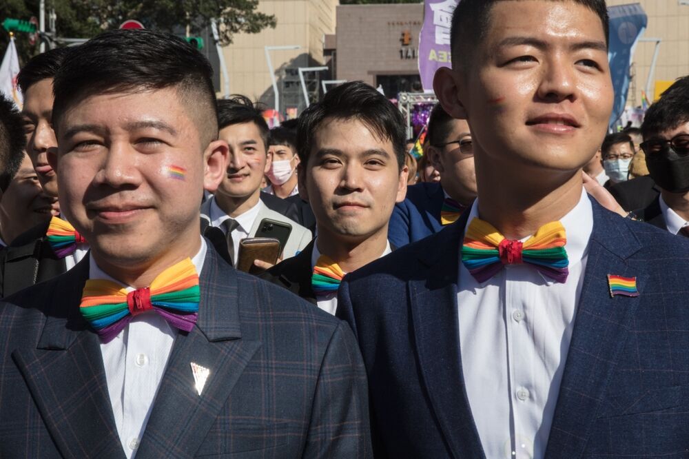 Activists hold rainbow flags and marks in LGBT rally in Taipei, Taiwan, on Oct. 31,2020.