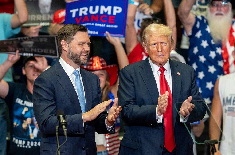 Vice-presidential nominee JD Vance, left, stands next to former President Donald Trump during a rally at the Van Andel Arena in Grand Rapids, Mich., on Saturday, July 20, 2024.