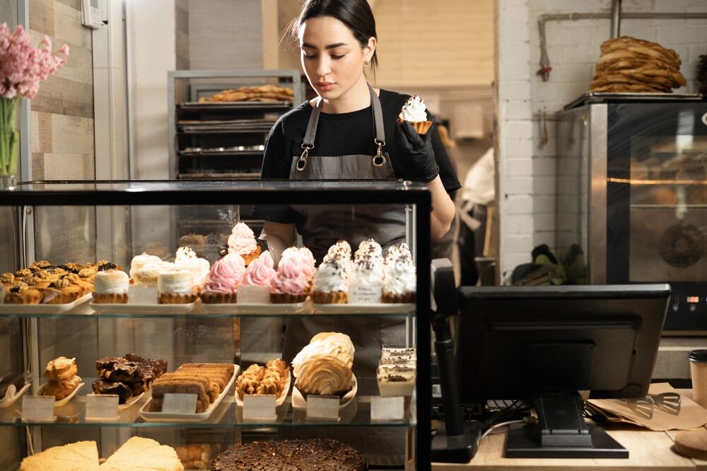 A woman working at a bakery