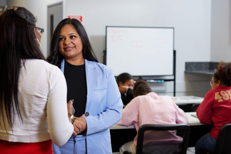 Nevada State Rep. Cecelia González (D) speaks with a student in her district in Las Vegas