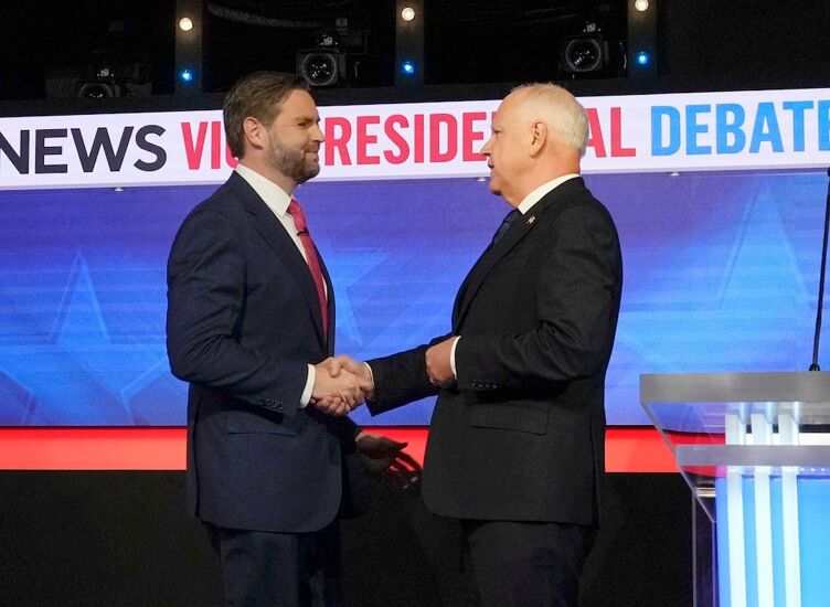 Republican JD Vance and Democrat Tim Walz greet before they square off during the CBS News vice presidential debate in New York City on Oct. 1, 2024.