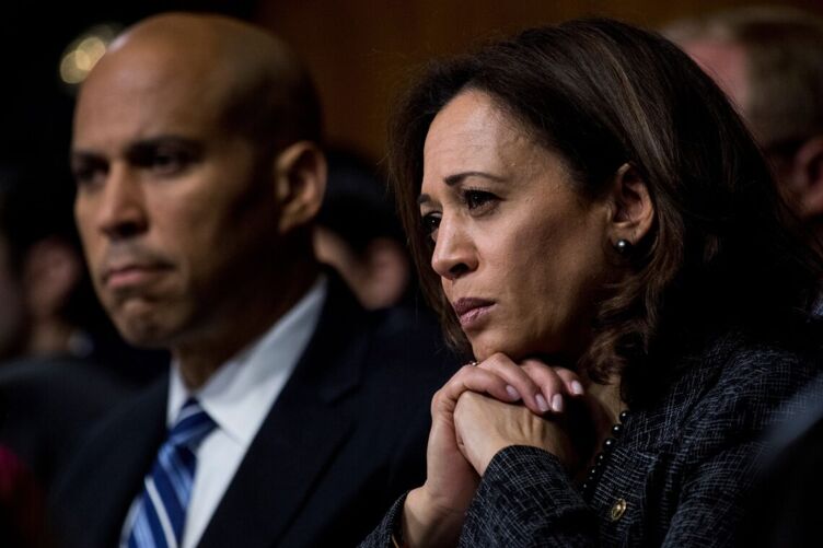 
Sen. Cory Booker and Sen. Kamala Harris, listen as Christine Blasey Ford testifies before the Senate Judiciary Committee about the assault then judicial-nominee Brett Kavanaugh allegedly perpetrated