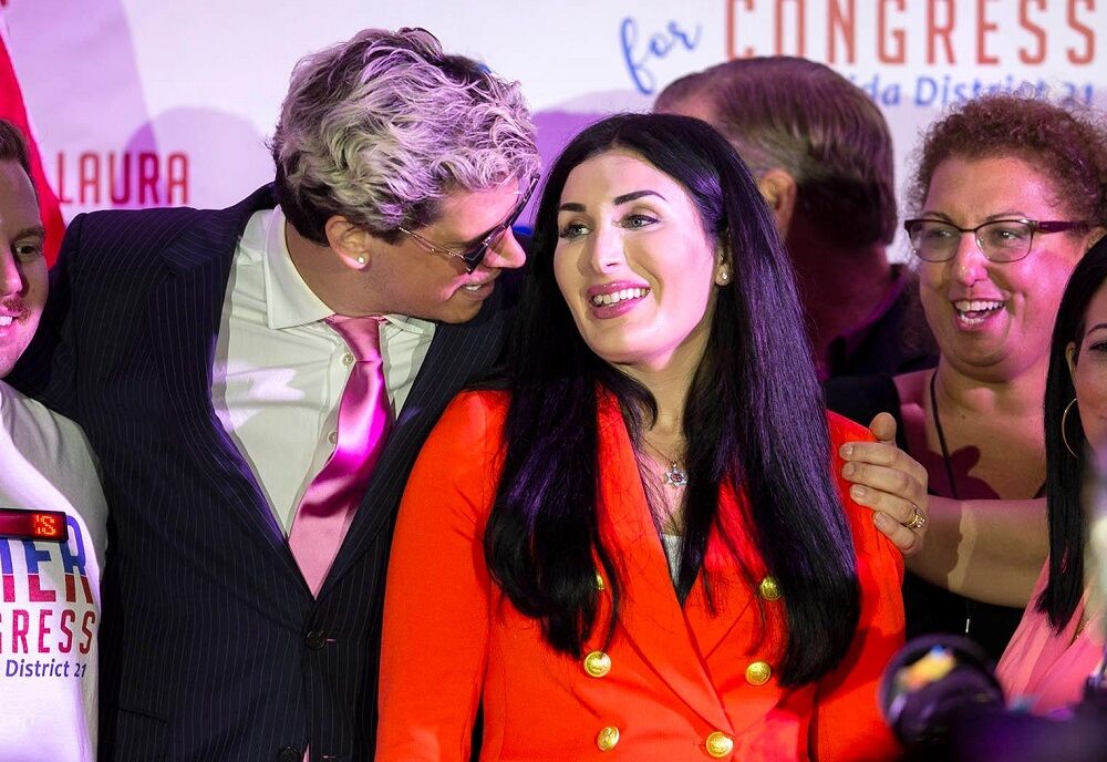 Republican congressional candidate Laura Loomer celebrates with Milo Yiannopoulos (left) on August 18, 2020