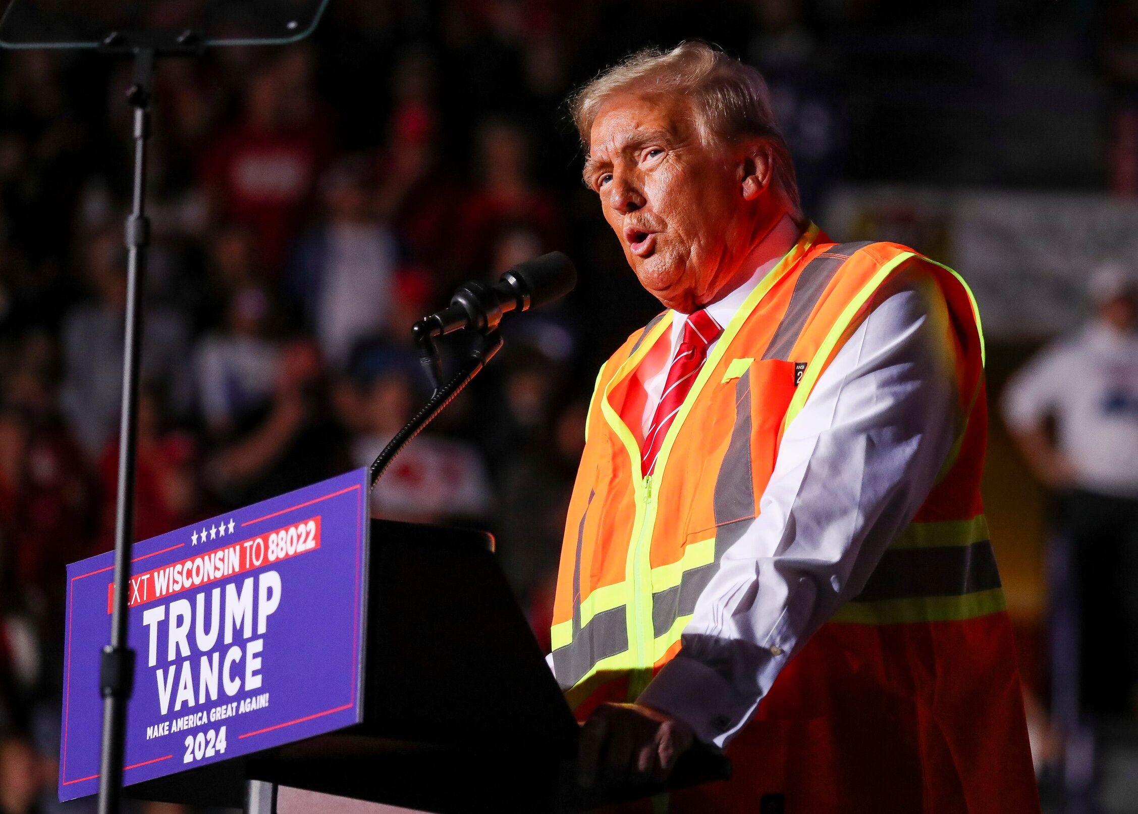 Republican presidential nominee Donald Trump speaks during a campaign rally on Wednesday, October 30, 2024, dressed as a sanitation worker