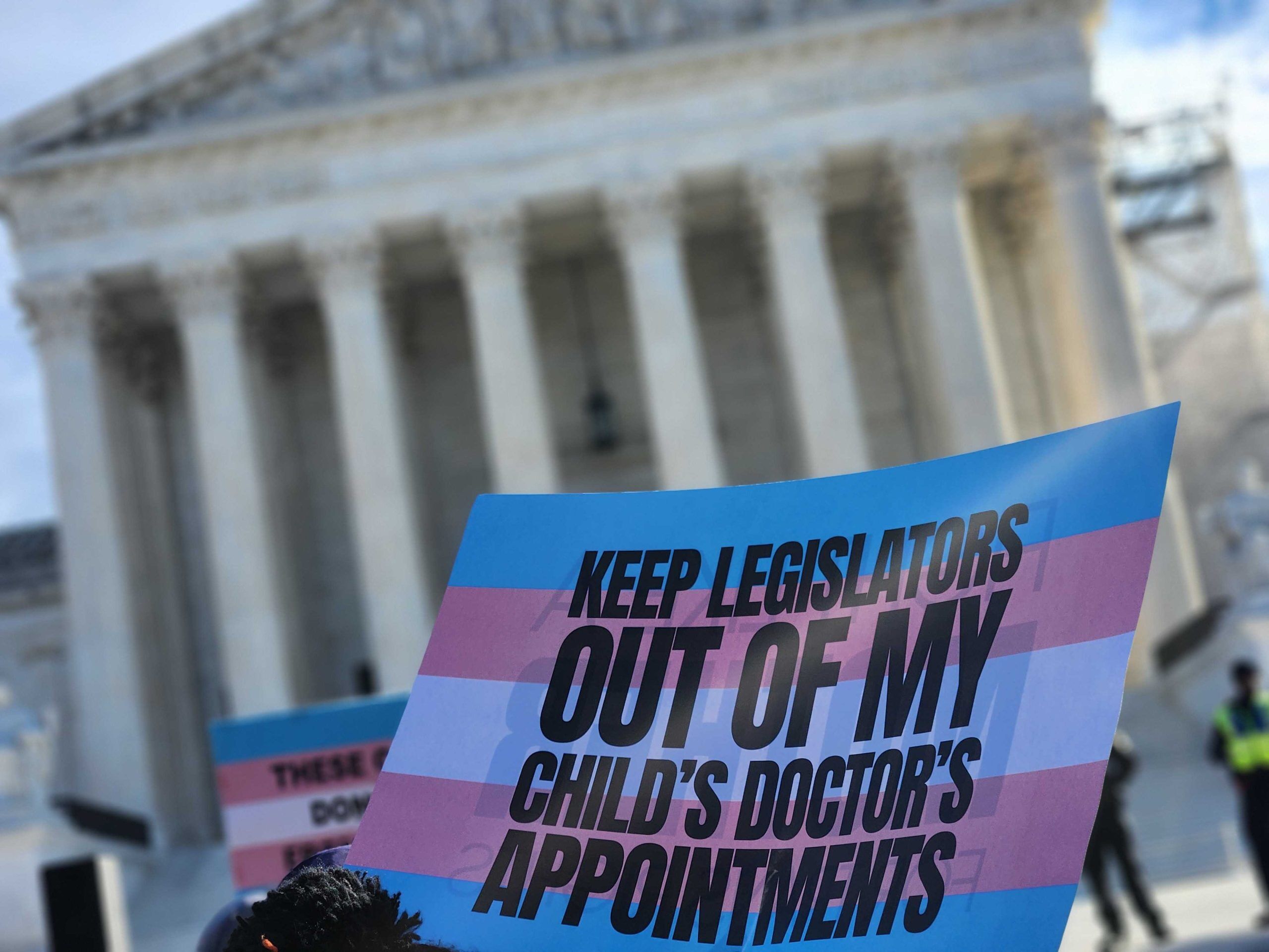 Protestors outside the Supreme court during oral arguments for United States v. Skrmetti